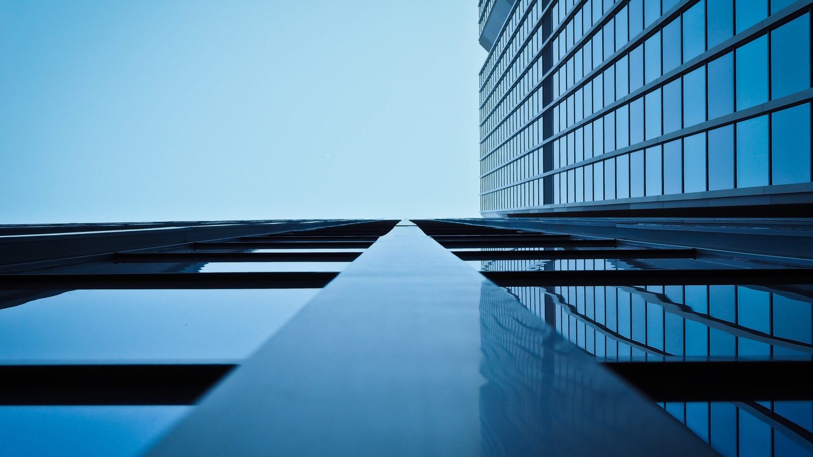 Elevate your business vision with this captivating shot of a skyscraper, looking up from the ground. Comtek delivers top-notch communication solutions in Des Moines, Ankeny, and across Iowa.